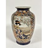 A Japanese craquelure pottery vase decorated with figure of a seated Japanese lady on a verandah