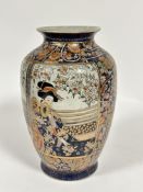 A Japanese craquelure pottery vase decorated with figure of a seated Japanese lady on a verandah