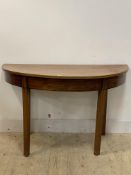 A Georgian mahogany demi lune side table, the plain frieze over square tapered supports, H72cm,