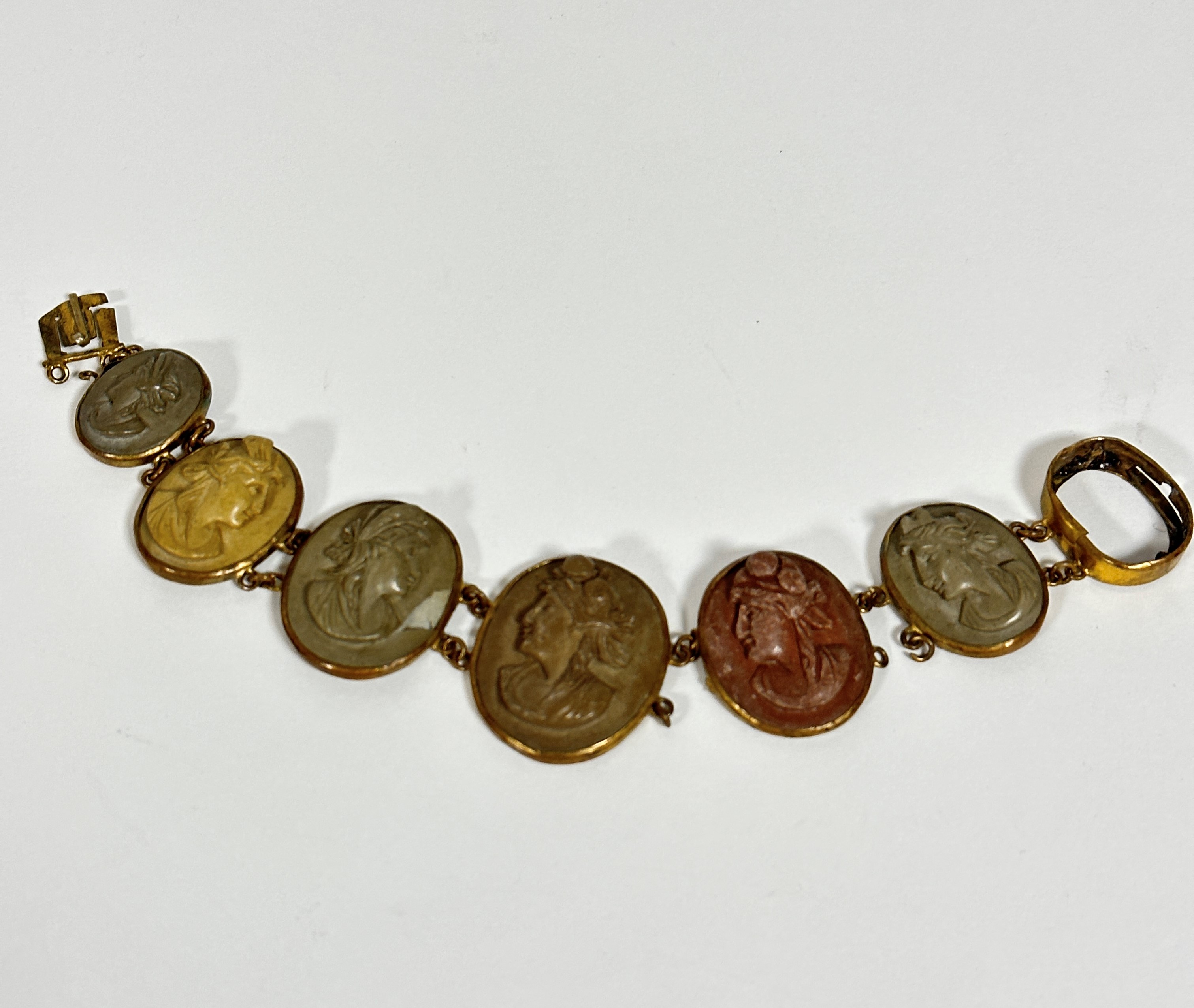 A 19thc gilt metal mounted graduated oval lava cameo bracelet, one panel missing, damage to links - Image 2 of 5