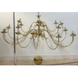 A large brass Dutch style chandelier with central column issuing eighteen scrolled branches D167cm