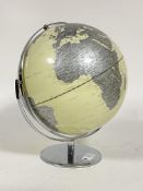 A contemporary 11" diameter terrestrial dual axis globe, on a chrome plated stand, H38cm