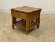 A stained hardwood lamp table, fitted with a drawer over an under tier, raised on square section