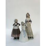 A Lladro figure of a Dutch girl with arms, a Lladro figure of a Goya lady (h-32cm) and a Miquel