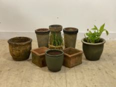 A pair of terracotta chimney pot planters (H35cm) together with seven other planters (9)