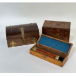 A trio of wooden boxes comprising one tea caddy with walnut veneer and two decorated with metal