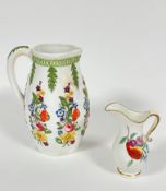 A 19thc china moulded jug decorated with green lattice style wreath to top with attached descending