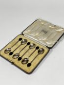 A set of six Birmingham 1926 silver bean handled coffee spoons complete with original case, retailed