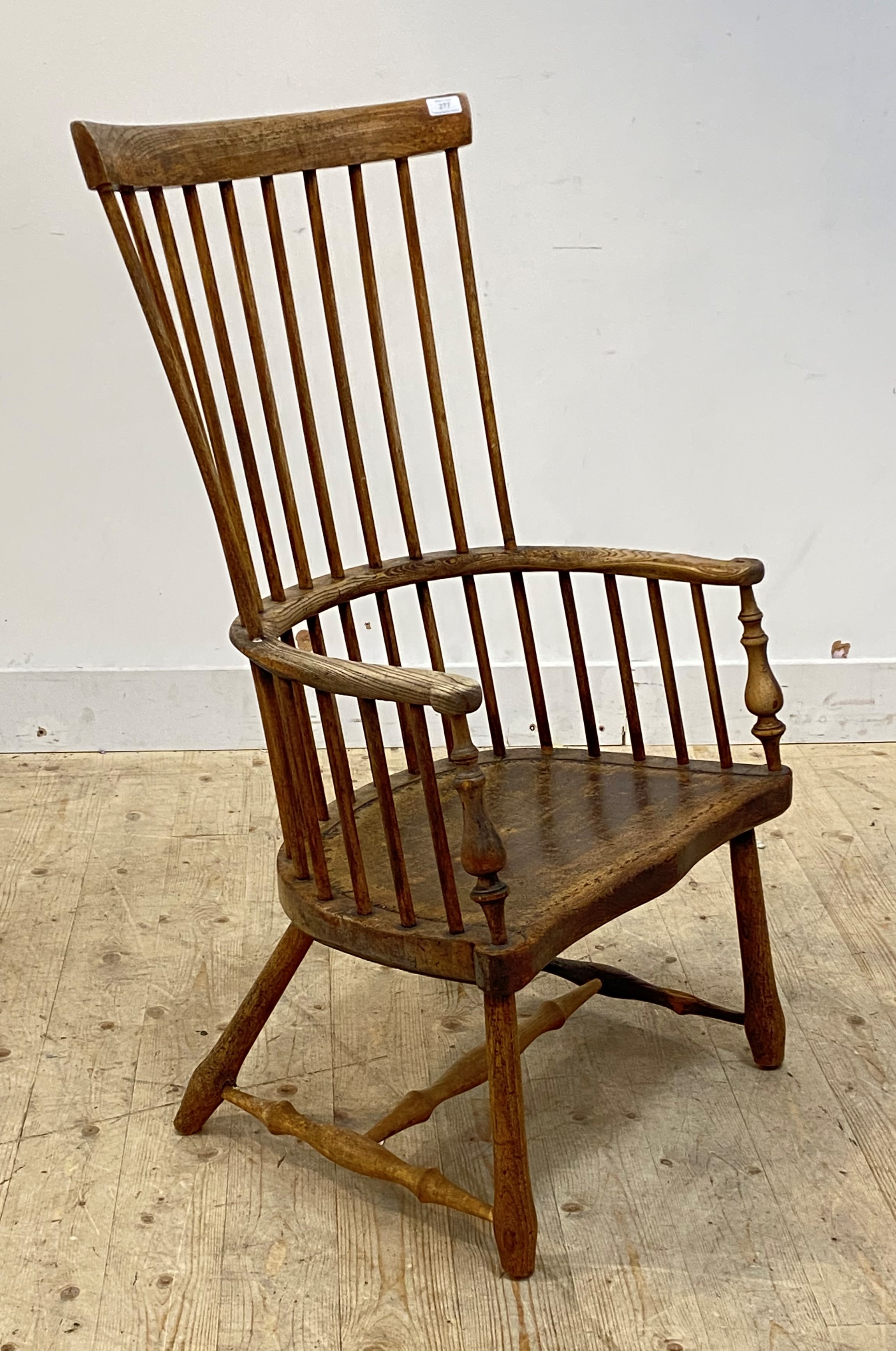 A vernacular early 19th century ash and elm Windsor comb back chair, the bowed armrest with scrolled - Image 2 of 2