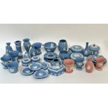 A group of Wedgwood Jasperware pottery, comprising three pink pieces, trinket boxes, vases,