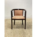 An Edwardian boxwood strung mahogany tub chair, upholstered in salmon shott silk, raised on square