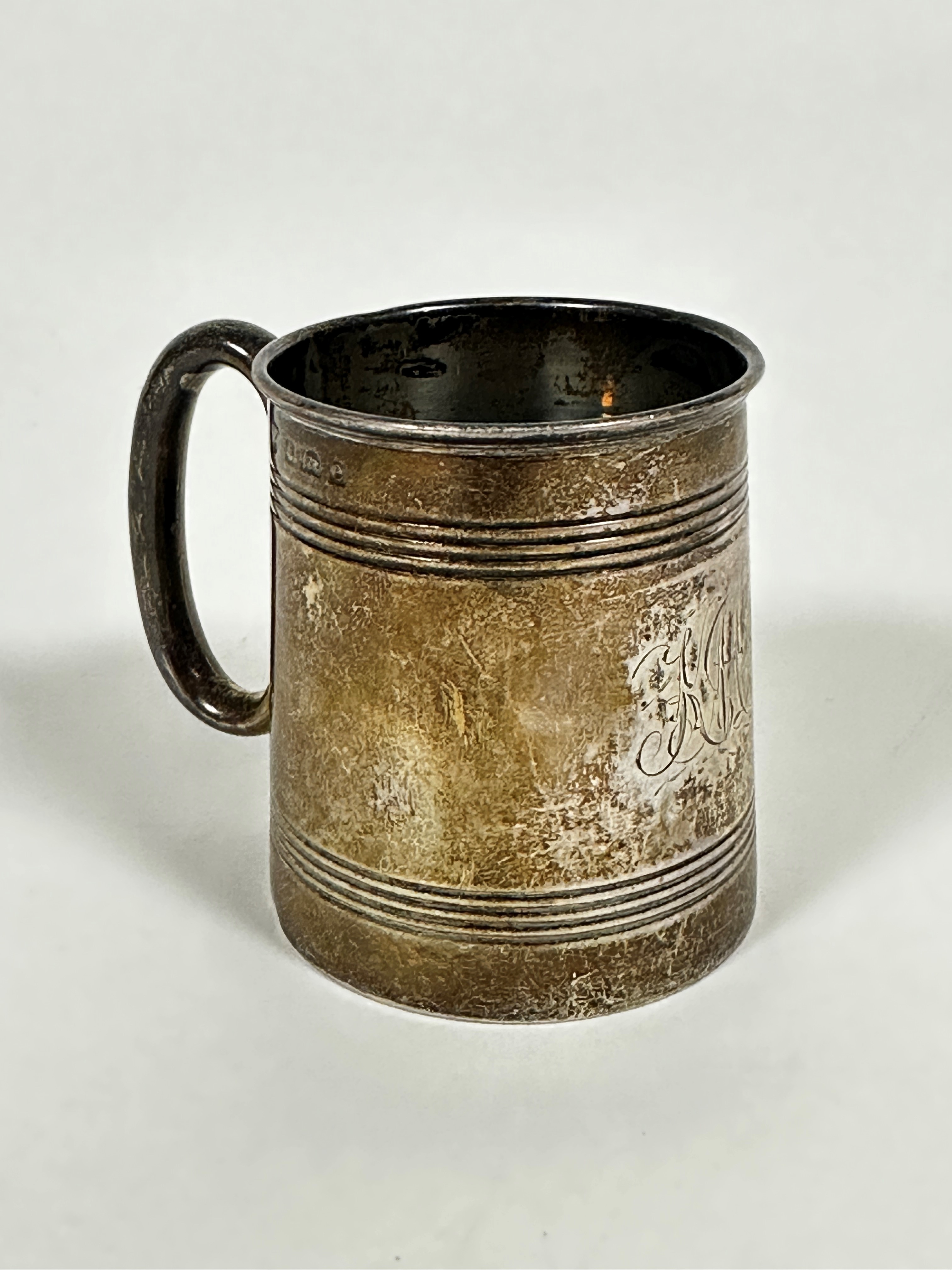 An Edwardian Birmingham silver tapered christening tankard with horizontal linear decoration and C