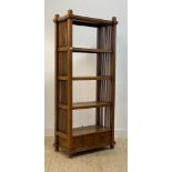 A stained hardwood three height open shelf, with slatted sides and two drawers to base, H195cm,
