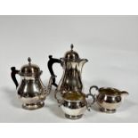 An Epns four piece tea and coffee service comprising dome top coffee pot with gadroon border and