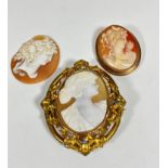 A Victorian yellow metal oval open work cameo brooch depicting a female in profile, (6.5cm x 5cm)