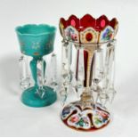 A 19thc cranberry glass overlaid girondle with crenulated top, on tapered column and spreading foot,