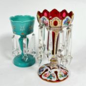 A 19thc cranberry glass overlaid girondle with crenulated top, on tapered column and spreading foot,