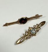 An 9ct gold Edwardian style bar brooch with oval amethyst with open work setting, (L: 15cm) and a