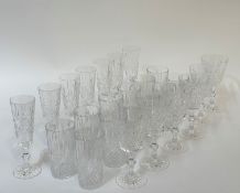 A group of crystal glasses comprising twelve moulded tumblers (h- 14cm), six cut crystal stemmed