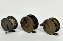 A group of three late 19th early 20thc brass fly fishing reels with vulcanite and early bakelite, (