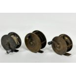 A group of three late 19th early 20thc brass fly fishing reels with vulcanite and early bakelite, (