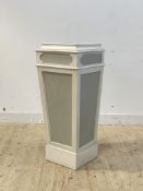 A white painted pine pedestal of tapering form with paneled front and sides, H106cm, W45cm, D44cm