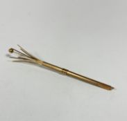 A 9ct gold engine turned decorated swizzle stick