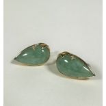 A pair of 14ct gold mounted pear shaped pale celadon jadeite earrings, mounted in scroll setting,