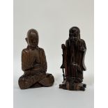 A hardwood seated figure of a Buddha (h- 25cm) with a Balinese wooden figure of a Laohan with a