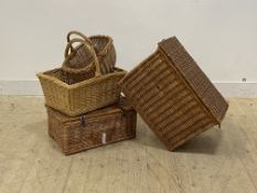 A large wicker lidded box with carry handle to each end and division to interior, together with a