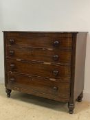 An early 19th century mahogany break bow front chest, with reeded moulding and four graduated