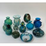 A collection of Maltese blown glass, comprising bottles and vases, all in blue/green colours, some