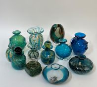 A collection of Maltese blown glass, comprising bottles and vases, all in blue/green colours, some