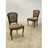 A pair of French Louis XV style beech framed bedroom chairs, early 20th century, with needlepoint