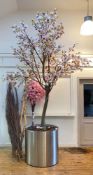 An Impressive artificial magnolia blossom tree, of sectional construction, in a cylindrical