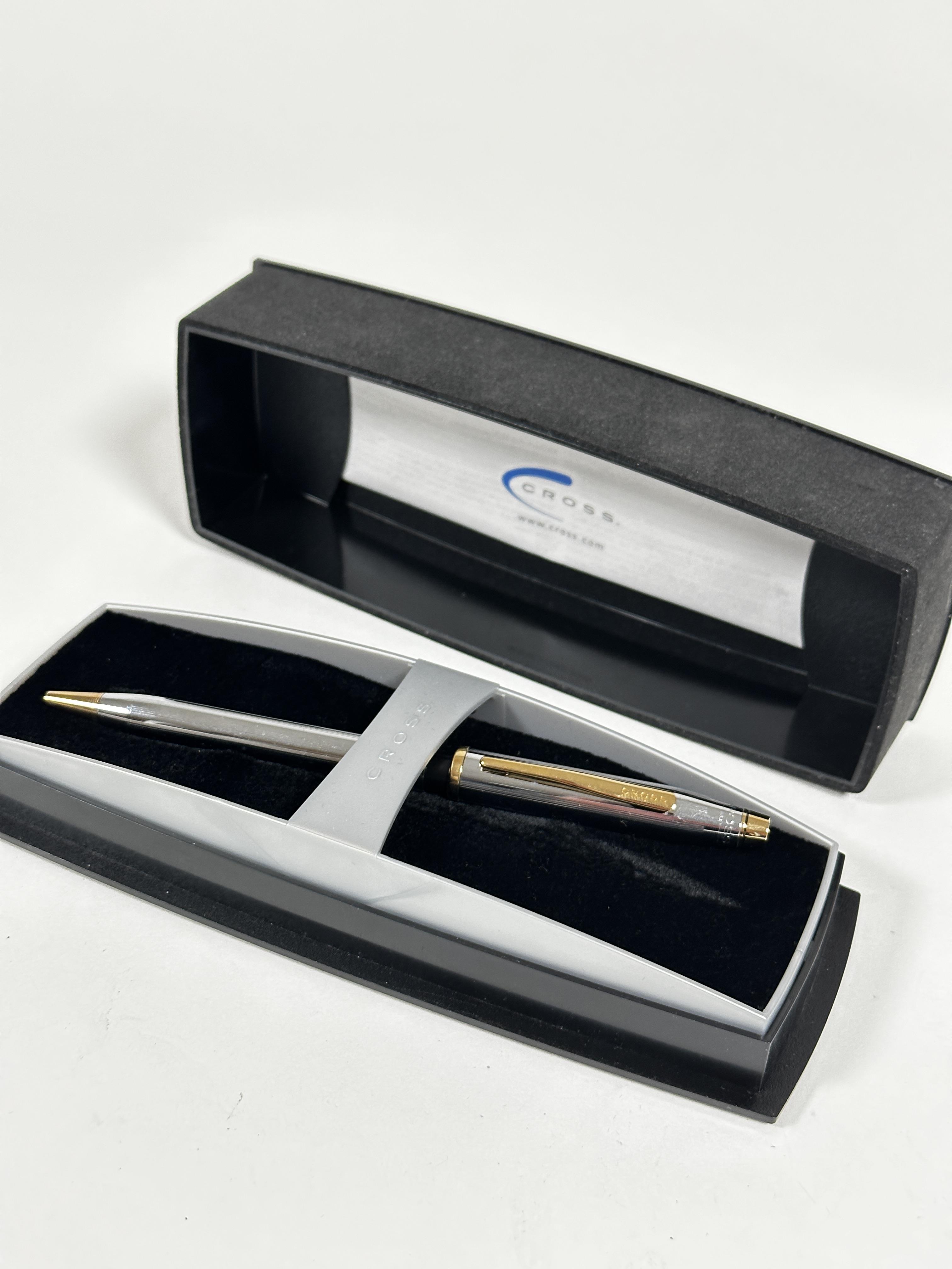 A Cross white and yellow metal ball point pen complete with original box and packaging