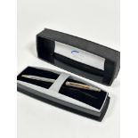 A Cross white and yellow metal ball point pen complete with original box and packaging