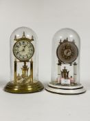 A Vintage Kundo brass Anniversary clock, in a glass dome, (H31cm) together with another