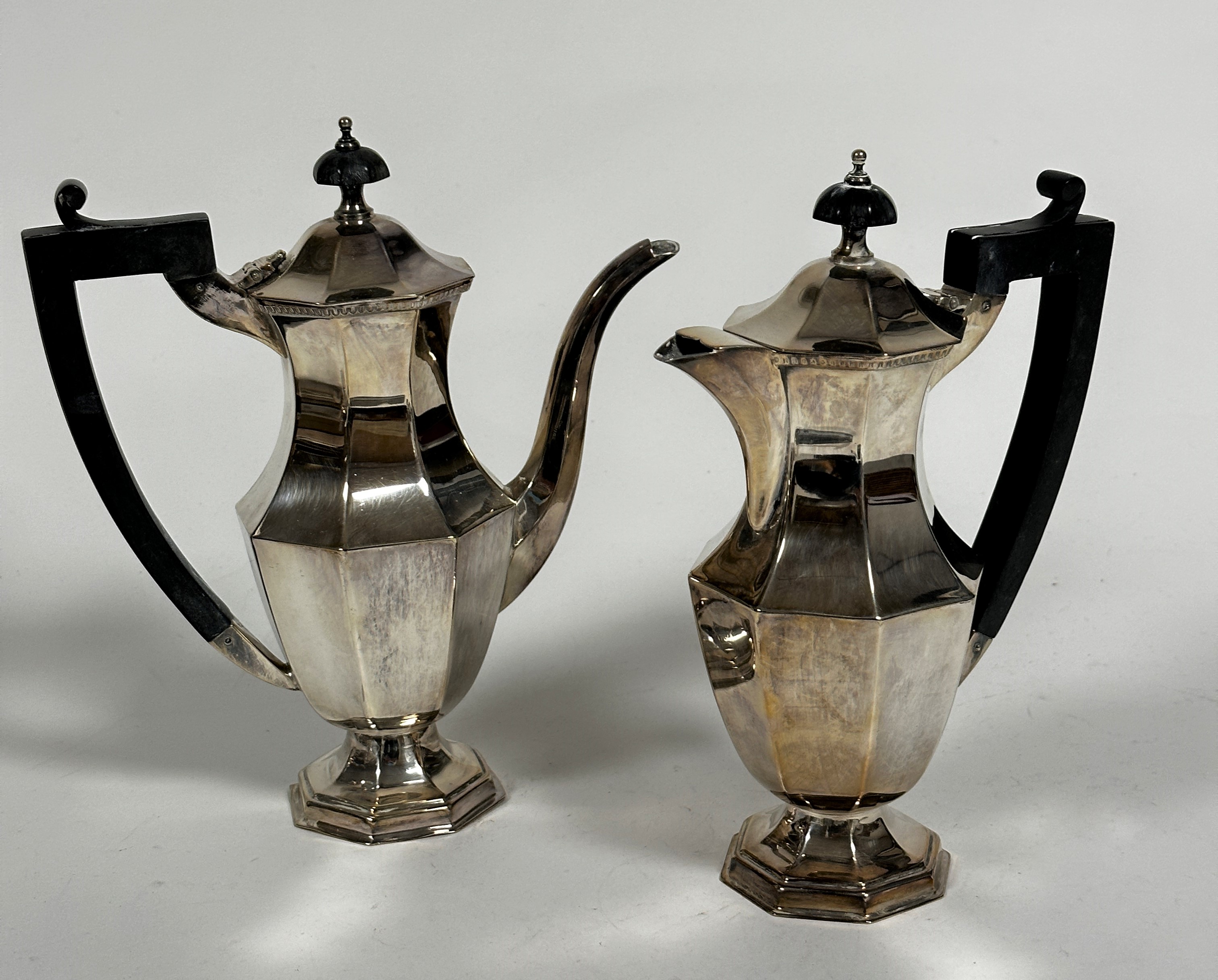 A pair of Viceroy Epns panelled coffee and hot chocolate pots of octagonal baluster form with