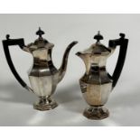 A pair of Viceroy Epns panelled coffee and hot chocolate pots of octagonal baluster form with