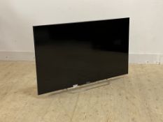 A Sony 50" flatscreen smart TV, with power lead and remote