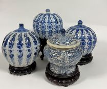 A pair of modern Chinese blue and white porcelain jars of pumpkin form decorated with stylized