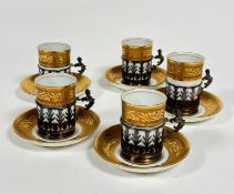 A Limoges ten piece porcelain coffee set, comprising, five gilded coffee cans with Birmingham 1926
