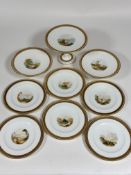 A 19thc nine piece china desert service including two fruit comports (h-7cm), a cake stand ( h-16cm)