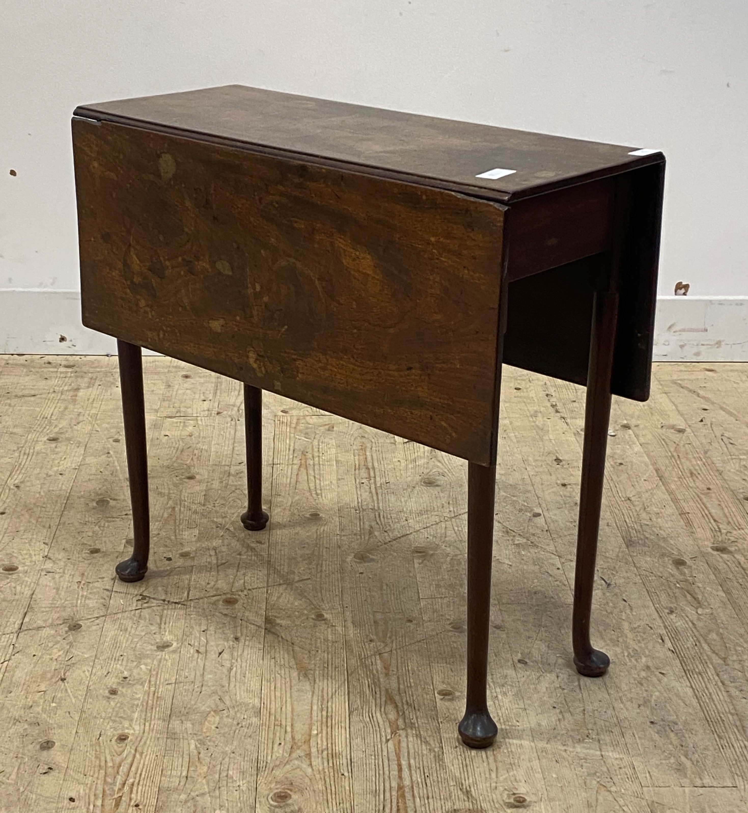 A George III mahogany side table, the two drop leaves supported on turned swing legs with pad