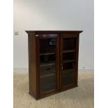 A mahogany wall hanging cabinet, early 19th century, the two glazed doors enclosing three shelves,