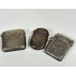 A Birmingham 1900 silver engraved silver vesta case, a Chester 1910 silver engraved rectangular