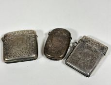 A Birmingham 1900 silver engraved silver vesta case, a Chester 1910 silver engraved rectangular