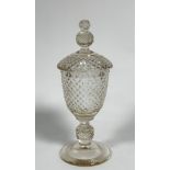 A 19thc crystal sweet meat dish and cover of Urn shape with hobnail cut finial, cover and base, on