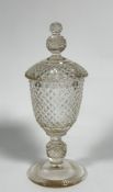 A 19thc crystal sweet meat dish and cover of Urn shape with hobnail cut finial, cover and base, on